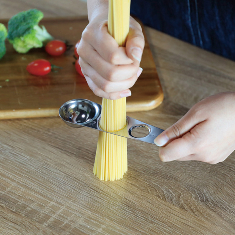 A measuring spoon that can also be used to measure pasta, , large
