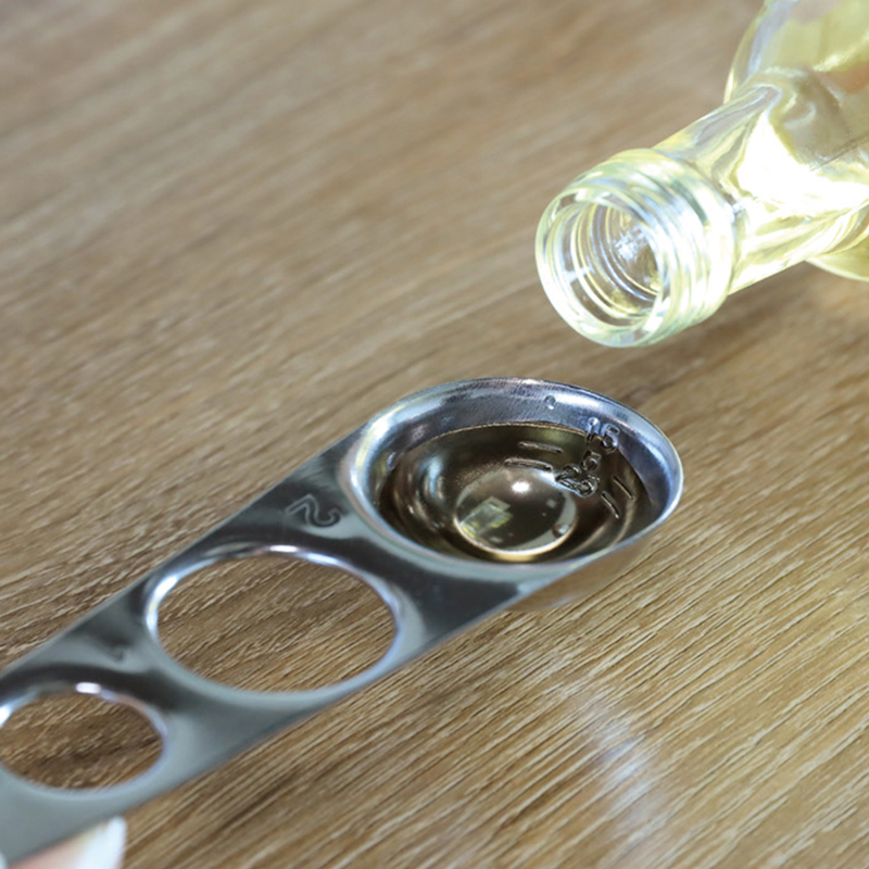 A measuring spoon that can also be used to measure pasta, , large