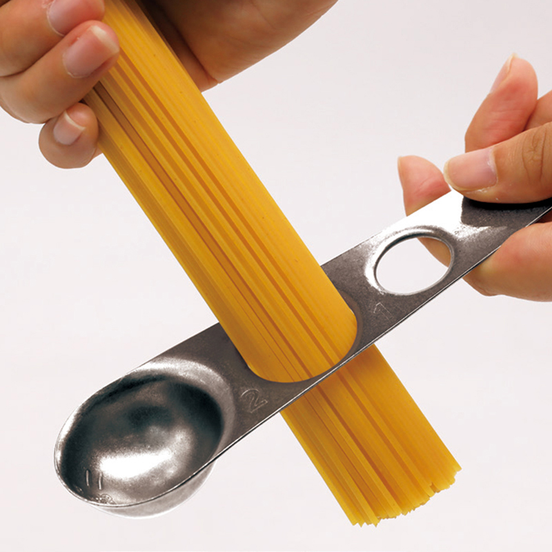 A measuring spoon that can also be used to measure pasta